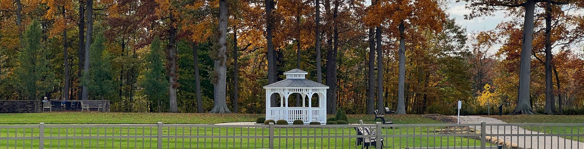 The gazebo at The Lodge at Geneva-on-the-Lake against a backdrop of fall foliage