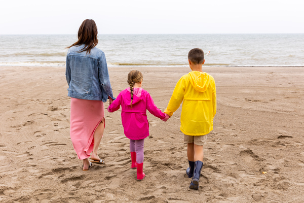 A mother and her children at the beach along Lake Erie