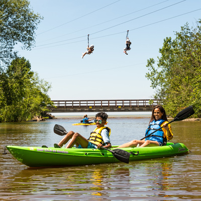 Two Geneva guests in a double kayak from Lake Erie Canopy Tours