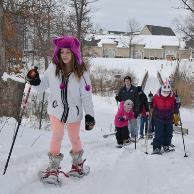 A family snowshoeing at The Lodge at Geneva-on-the-Lake